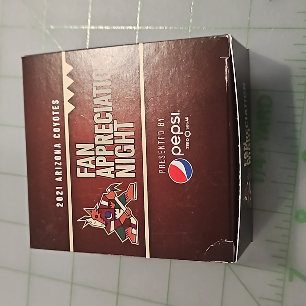 Coyotes hockey puck, signed by Lyubushkin